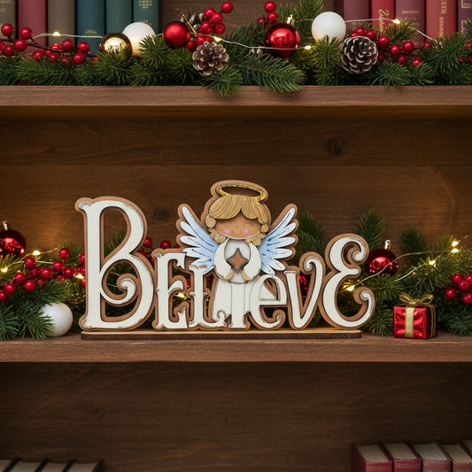 Decorative sign with angel and 'BELIEVE' letters on a wooden background- off white in color with gold glitter accents
